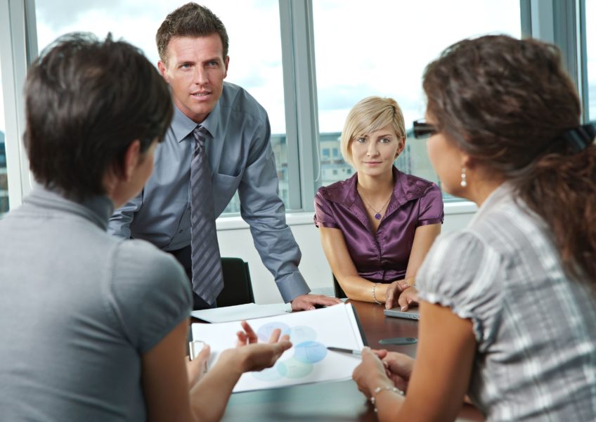 6285988 – group of young business people talking on business meeting at office.